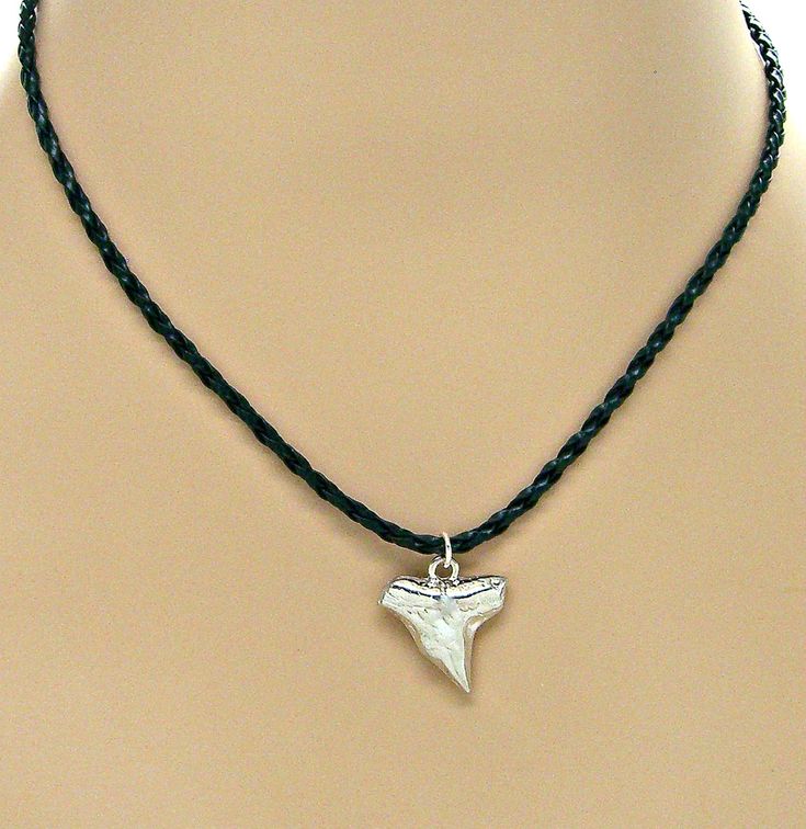 Silver Shark Tooth Necklace 17" to 19" Adjustable Faux Braided Leather Surfer SUP 9000-06 #NecklacePendant #beach #adjustable #surfer #SharkNecklace #sup #MensNecklace #SharkWeek #BoysNecklace #BeachJewelry Shark Tooth Necklace Mens, Shark Teeth Jewelry, Faux Leather Necklace, Necklace Styles, Silver Shark, Boys Necklace, Tooth Pendant, Shark Necklace, Shark Tooth Necklace