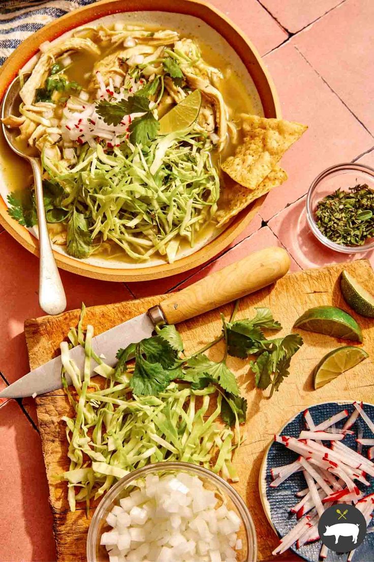 two bowls filled with food sitting on top of a table