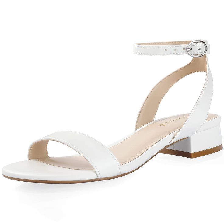 a woman's white high heeled sandal with ankle strap and two straps