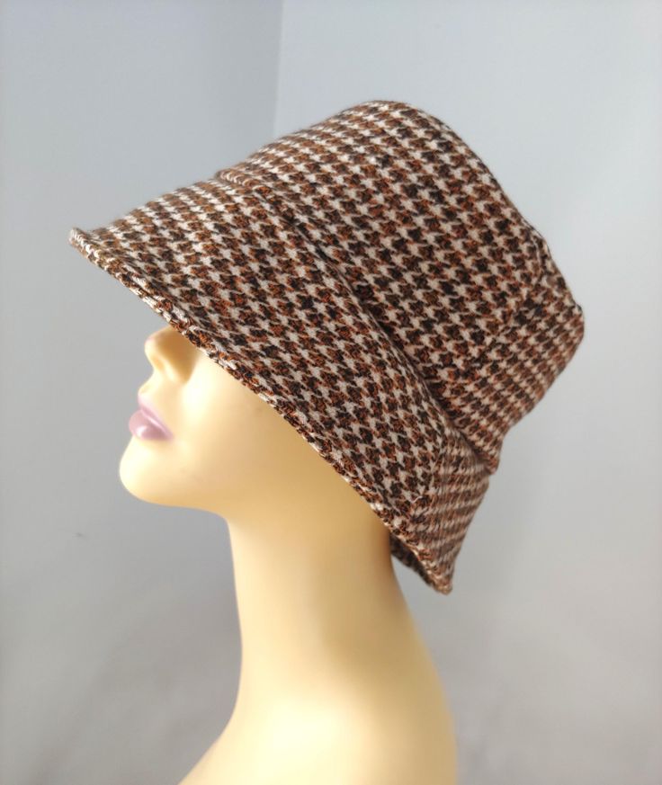 Stylish Unisex Houndstooth bucket hat. Made from light wool blend/cotton/polyester tweed fabric. Soft, warm, light and stylish. Unisex pattern...keeps head warm and protects well from the sun. For your comfort and breathability, the hat is lined in a plain cotton flannel. Easy piece to take with you in your bag, rolled up or folded. Please choose from the following sizes - Small - 22"   fits my 21.5 head perfectly but size up if you prefer a less snug fit Med - 23" Large - 24" XL - 25" If you prefer a less exact fit, please choose a size up. Approx. dimensions: Brim is about 2.75" Crown height/band is about 3" [Washing] Hand wash cold & air dry. All fabrics used are from my leftover projects. Ready to ship. Bucket Hat For Men, Brown Hat, Mens Bucket Hats, Brown Hats, Hat For Men, Hat For Women, Tweed Fabric, Bucket Hats, Cold Air