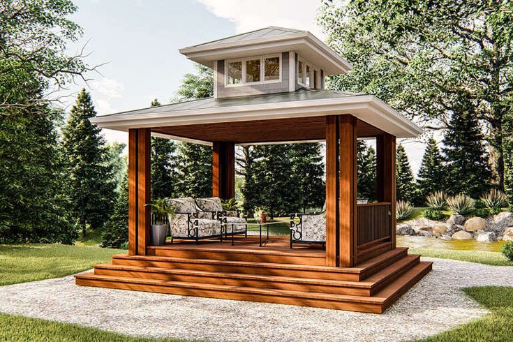 a gazebo sitting on top of a lush green field