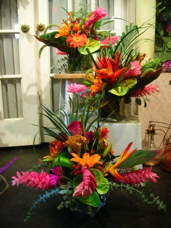 a bouquet of flowers sitting on top of a white box in front of a door