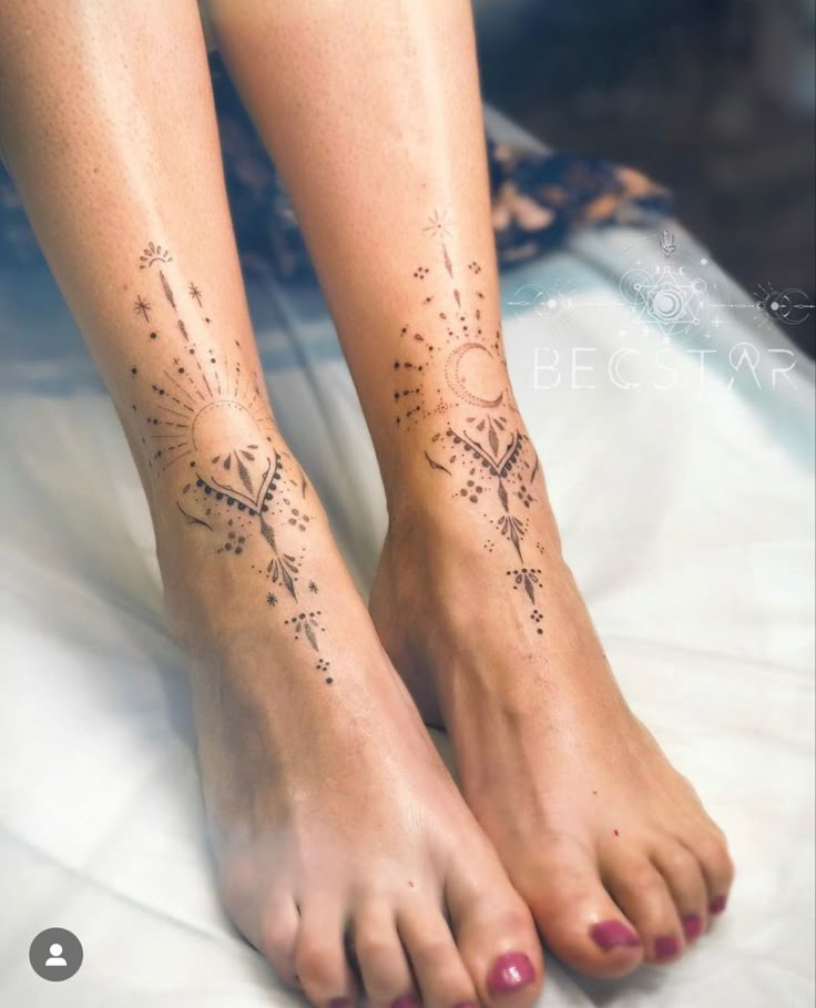 a woman's foot with tattoos on it