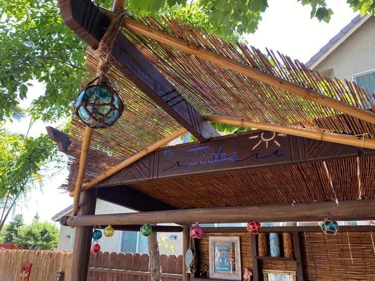 the outside of a building with a clock on it's roof and some decorations