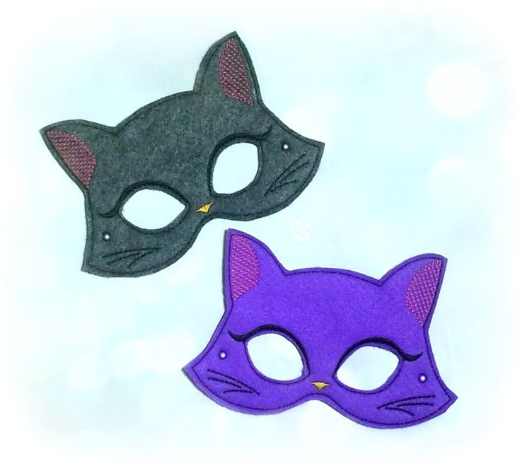 two masks are shown on a white surface, one is purple and the other is black