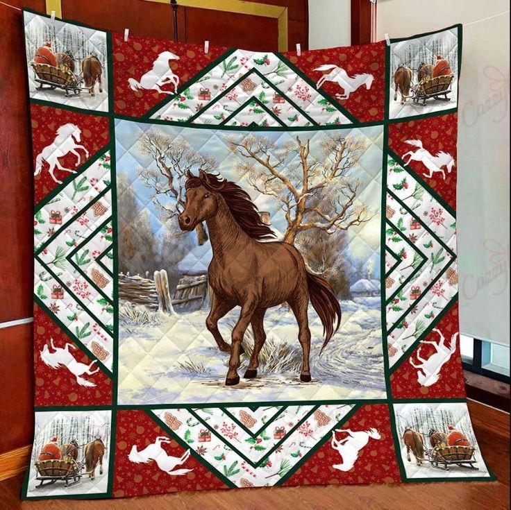 a quilt with horses running in the snow on it's front and back sides