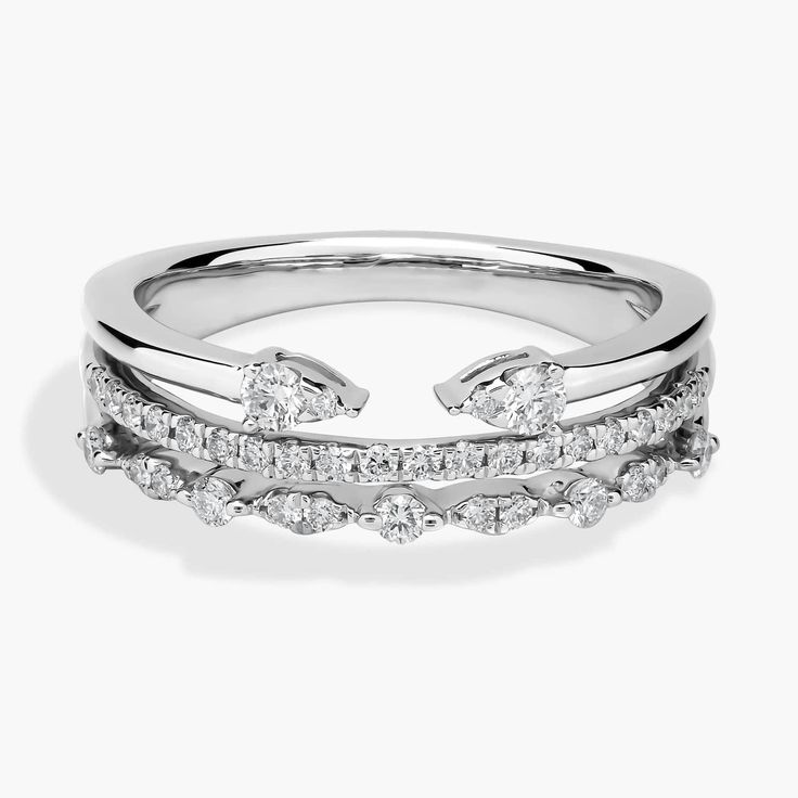 a white gold ring with three rows of diamonds on the sides and an open band