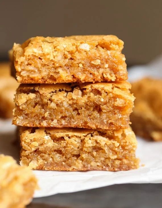 three pieces of food are stacked on top of each other in front of the camera