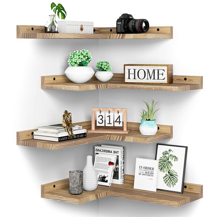 three wooden shelves with pictures, books and plants on them