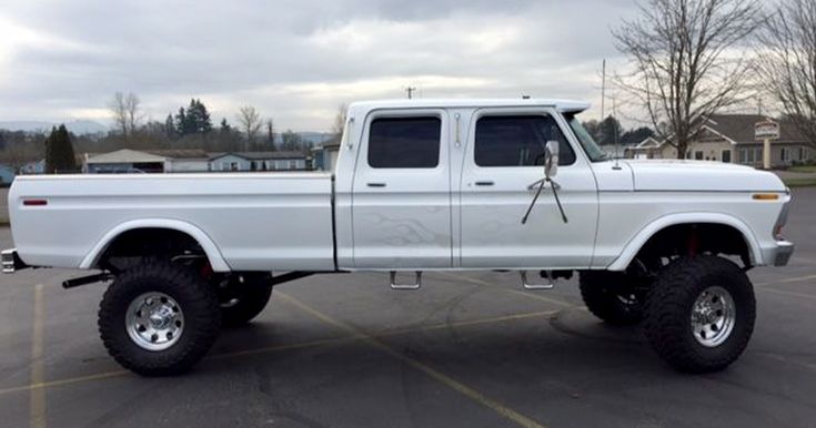 a white pickup truck parked in a parking lot