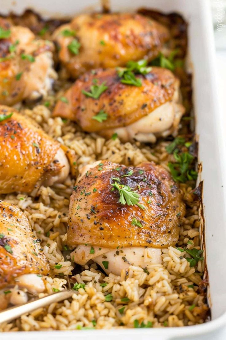 chicken and rice in a white casserole dish