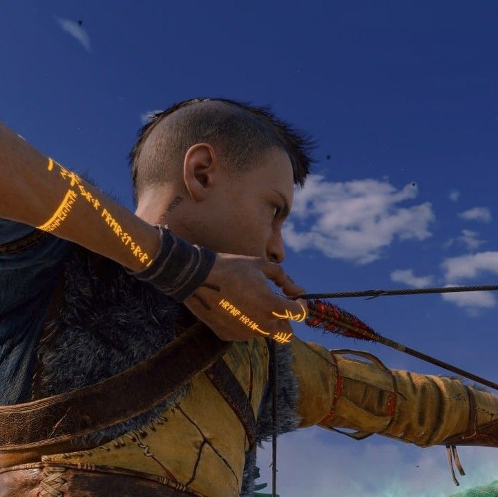 an image of a man aiming at something with his bow and arrow in front of him