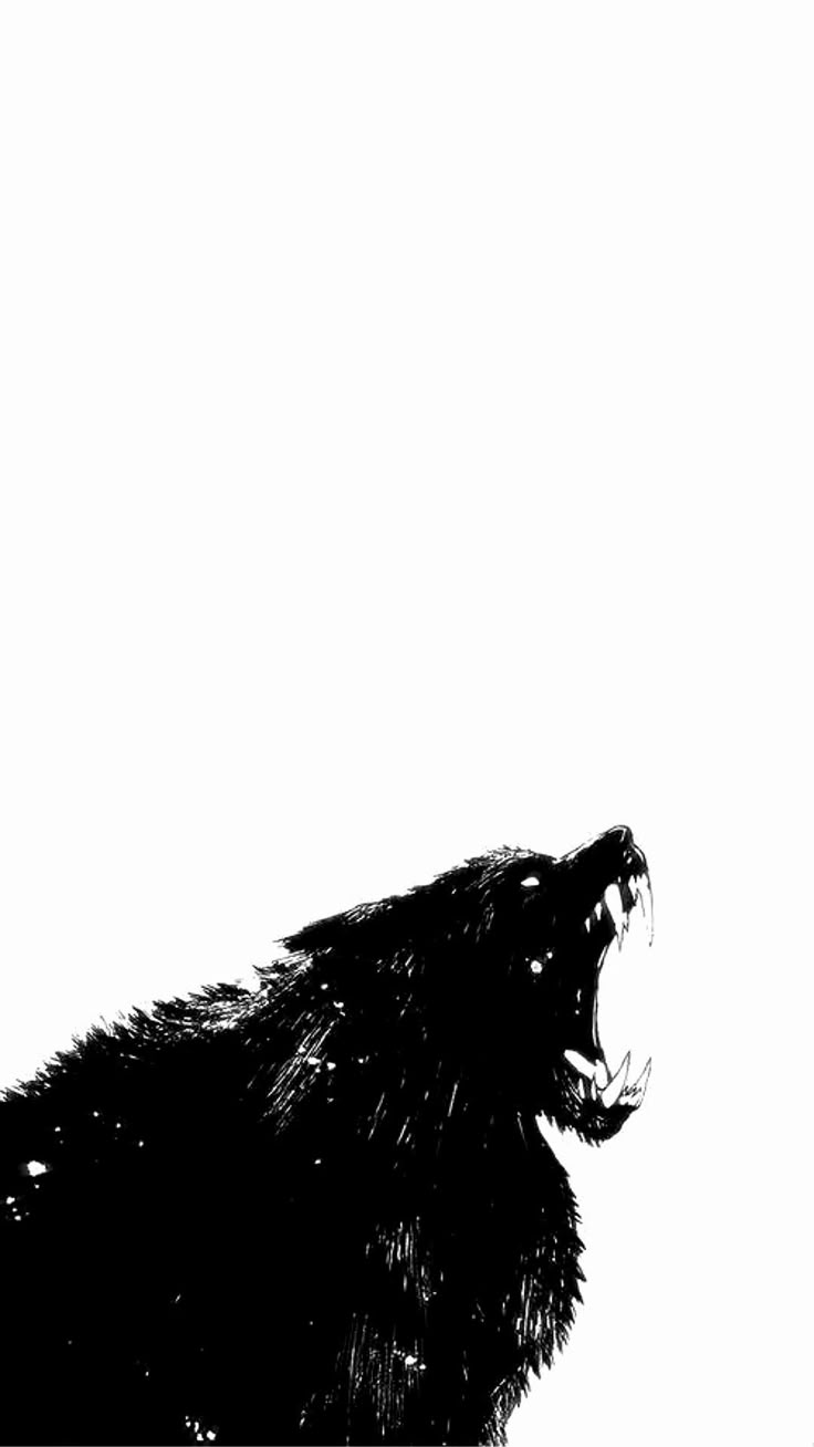 a black and white photo of a bear's head with it's mouth open