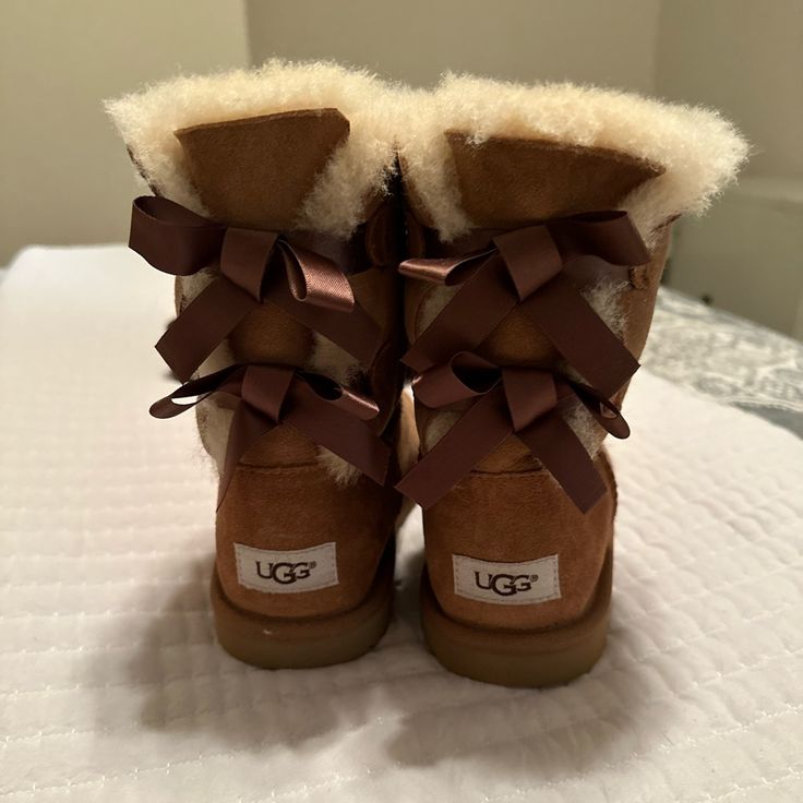 Brand New, Never Worn Women’s Ugg Bailey Boots With Satin Bow Accents. White Shoes For School, Bailey Uggs, Fur Uggs, Ugg Boots Women, Boots With Bows, Ugg Boots With Bows, Ugg Bailey Boots, Winter Song, Cute Uggs