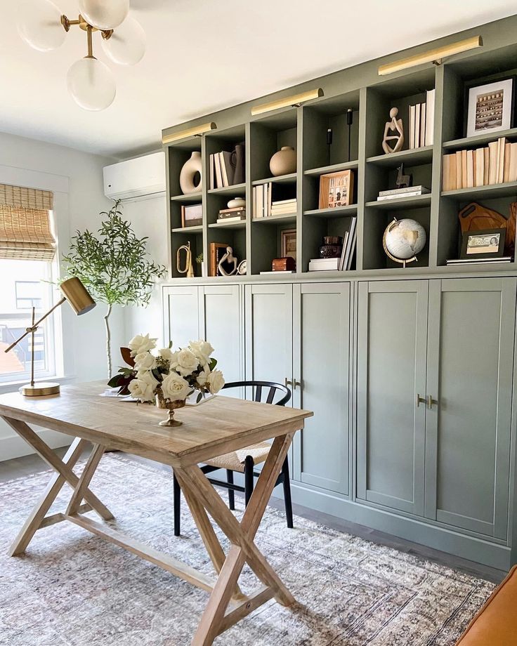 a living room filled with furniture and bookshelves