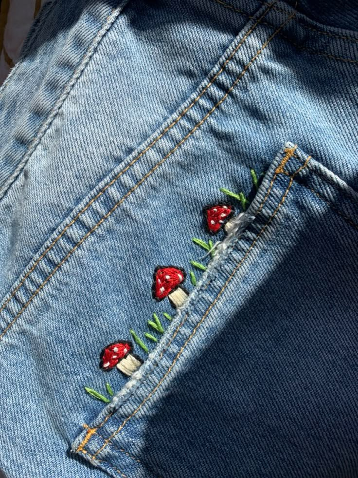 toadstool embroidery with grass Embroidery Designs On Jeans, Embrodiary Design, Personalized Jeans, Jean Embroidery, Jeans Bordado, Embroidery Jeans Diy, Embroider Ideas, Jeans Embroidery, Clothes Embroidery Diy