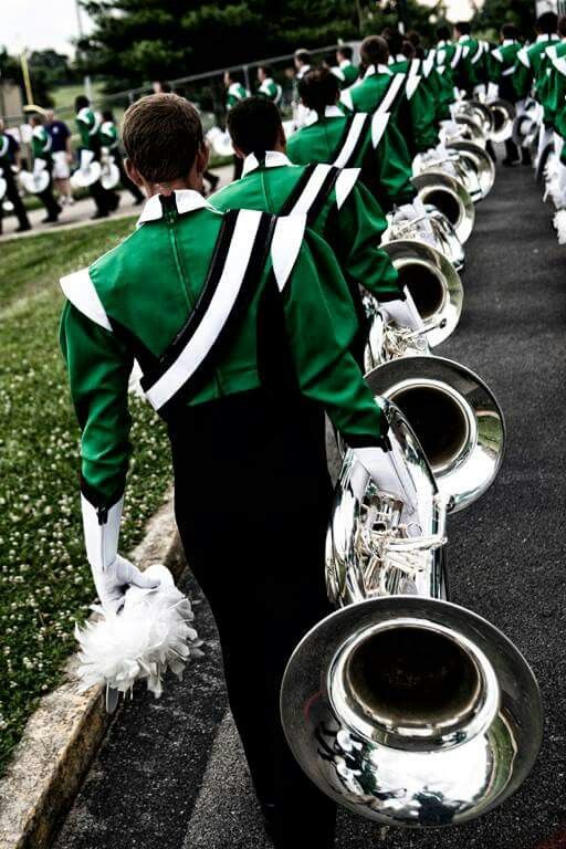 a marching band is lined up on the street