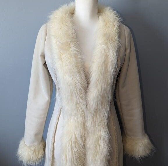 Elevate your winter wardrobe with timeless elegance and cozy warmth with our Women Penny Lane Shearling Coat. This fur coat is a perfect blend of vintage charm and contemporary style, reminiscent of the iconic 90s fashion. Crafted with precision, this long princess coat exudes boho and hippie vibes, making it a must-have for fashion enthusiasts. The Afghan-inspired design and the luxurious white suede material add a touch of sophistication, ensuring you stand out in the crowd. Embrace the allure Cream Long Fur Coat, Afghan Coat, Long Penny Lane Coat, Cream Vintage Fur Coat For Winter, Vintage Penny Lane Coat, Penny Lane Fur Coat, Penny Lane Coat, White Fur Coat, Princess Coat