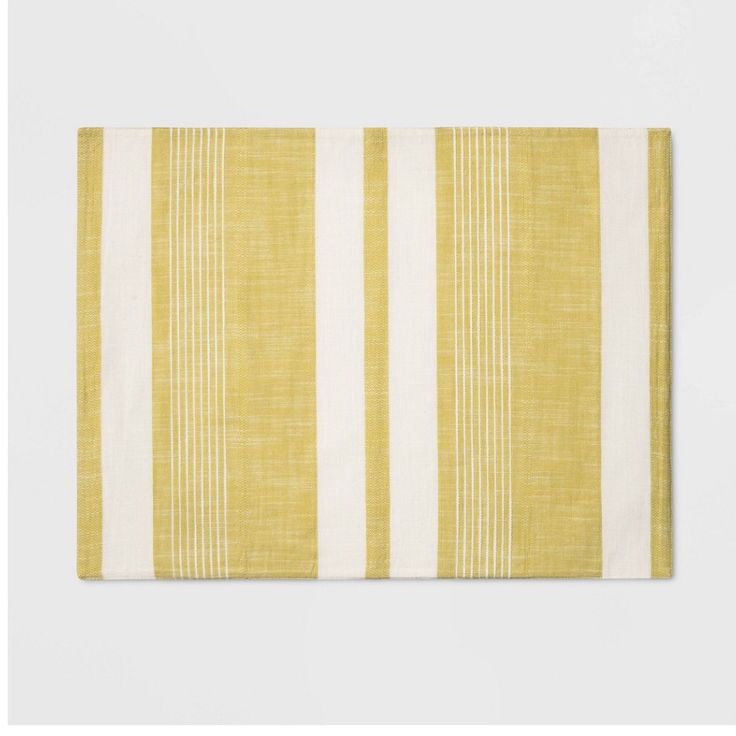 a yellow and white striped placemat