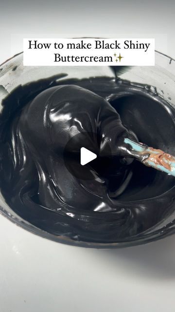 a spoon full of chocolate with the words how to make black shiny buttercream