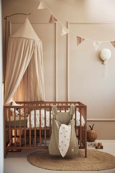 a baby's room is decorated in neutral colors