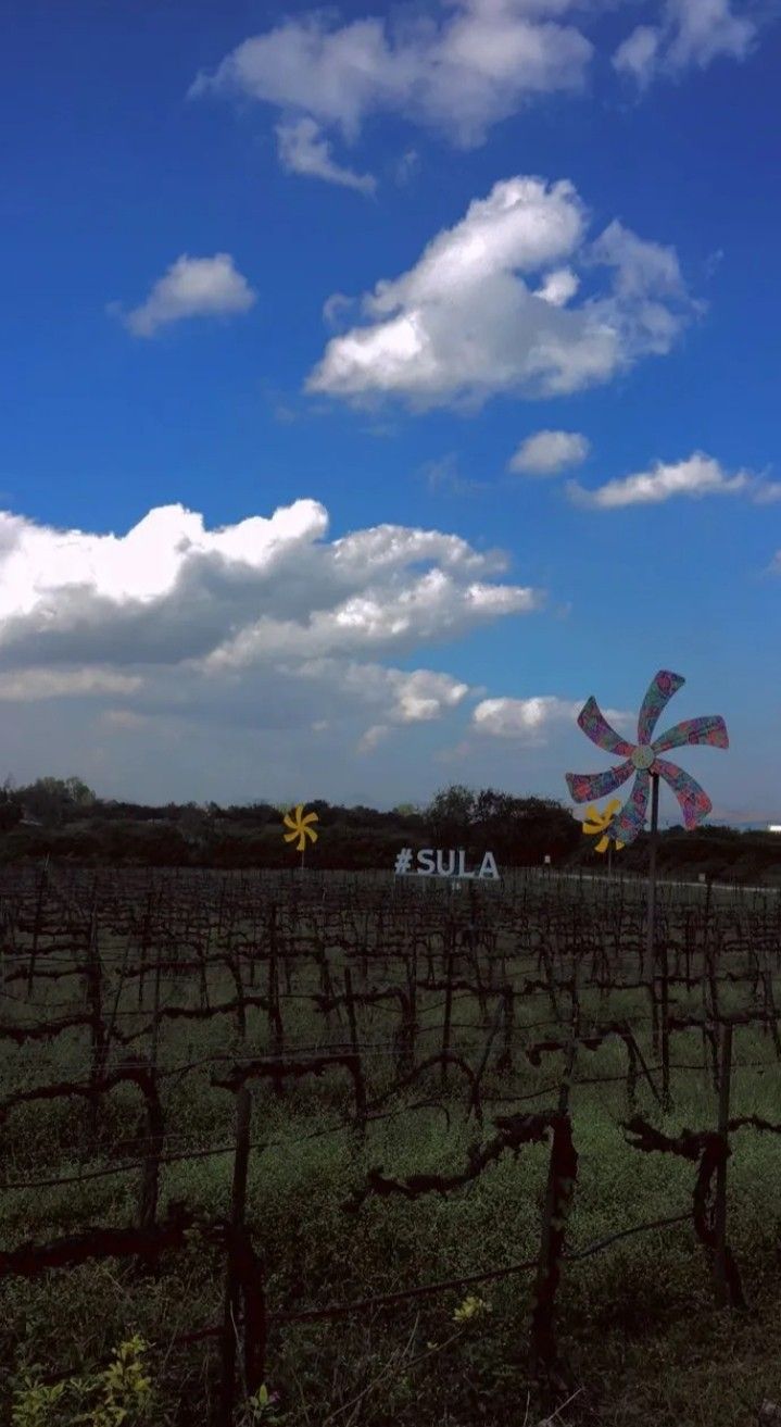 a large windmill in the middle of a field