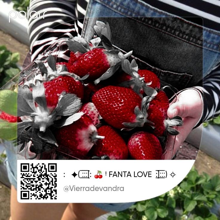 a person holding a bunch of strawberries in their hands