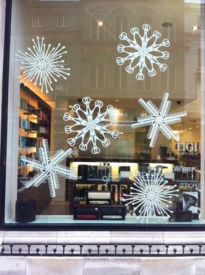 a store window with snowflakes in it