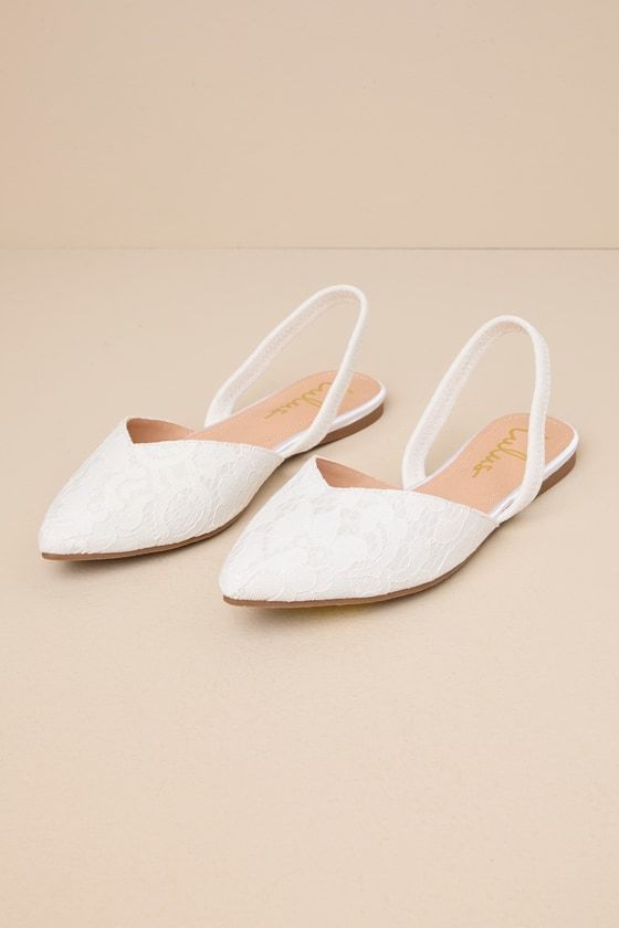 Step into style with the Lulus Mae White Lace Pointed-Toe Slingback Flats! These sweet cuties are the perfect blend of chic and sensible with their low-maintenance flat sole, comfortable elastic slingback strap, and cute notched pointed-toe upper composed of romantic floral lace. 0. 25" rubber heel. Lightly cushioned insole. Felted rubber sole has nonskid markings. Man made materials. Imported. Lulus | Mae White Lace Pointed-Toe Slingback Flats | Size 6.5. Comfortable Wedding Shoes For Bride Ballet Flats, Bridal Shoes No Heel, Flat Wedding Shoes For Bride Boho, Wedding Shoe Flats, White Bride Shoes, White Slingback Flats, Wedding Flats For Bride Sandals, Wedding Shoes No Heel, Flat Wedding Shoes For Bride