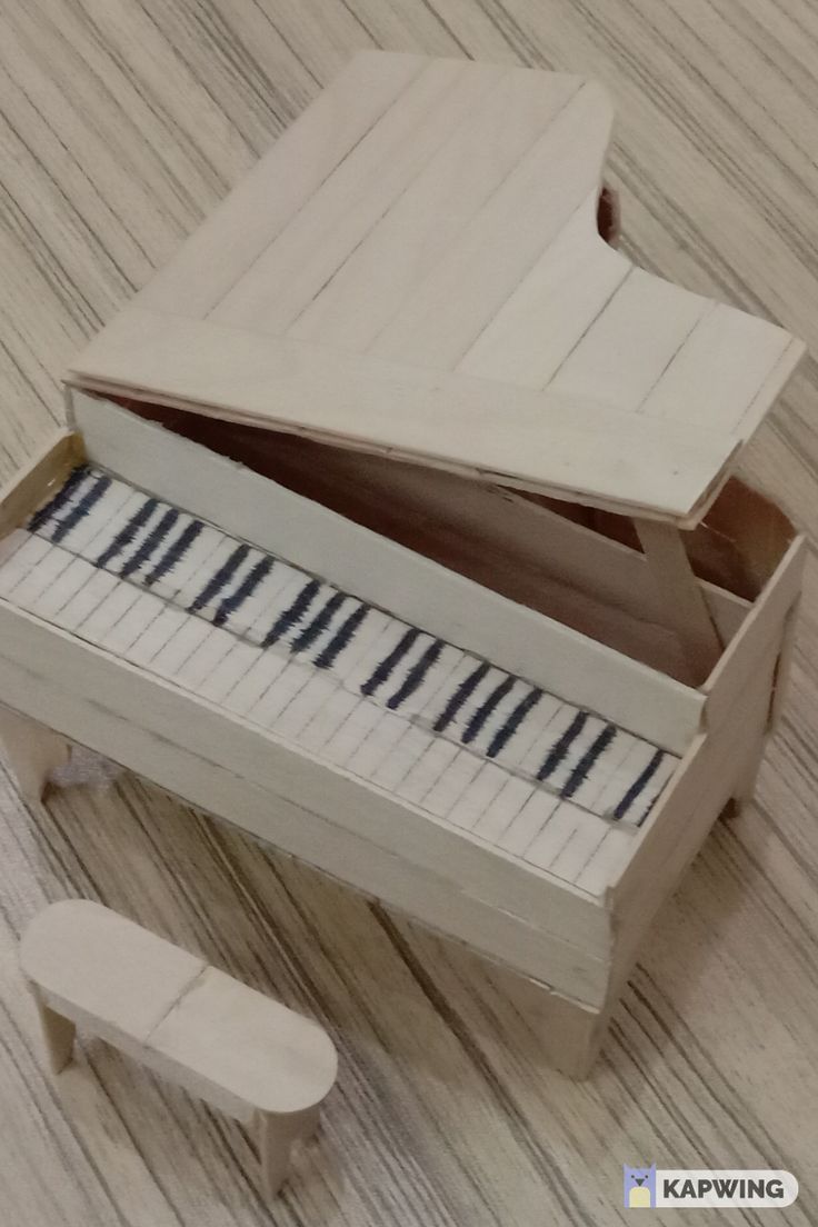 an open box with a piano on the floor