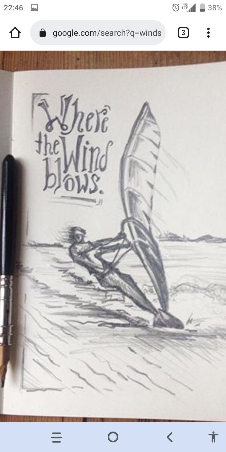 an open notebook with a drawing of a person windsurfing on the water