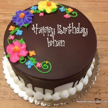 a chocolate birthday cake with flowers on it and the words happy birthday, any names here