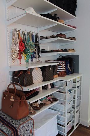 the closet is full of purses and handbags on shelving shelves with drawers