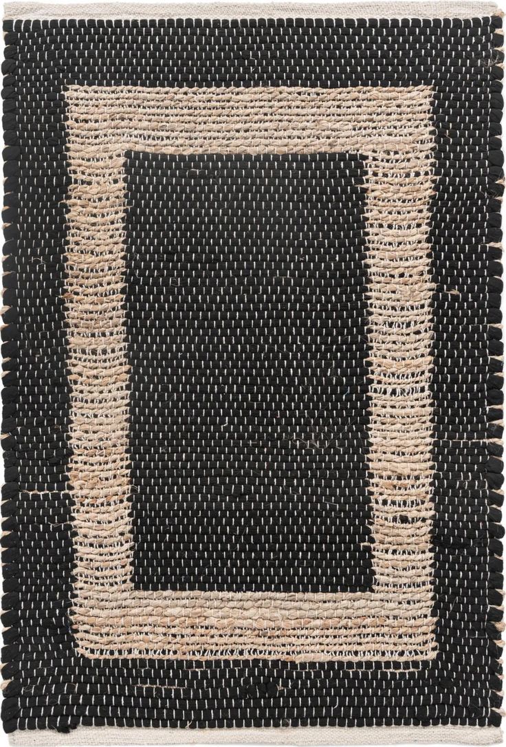 a black and white rug with an area made out of jute, rope and yarn