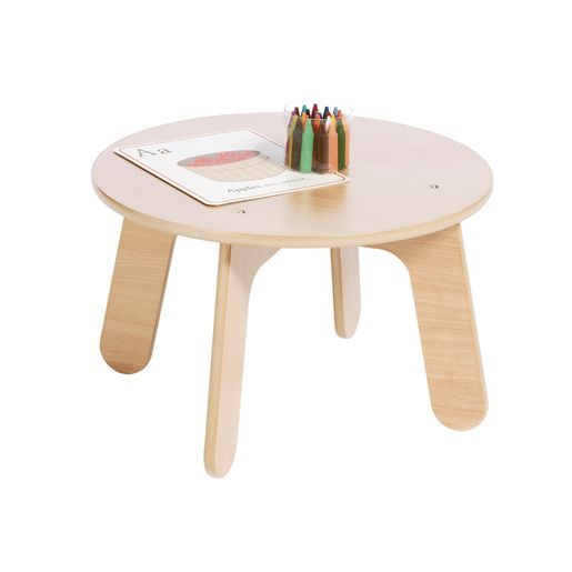 a small wooden table with colored pencils on it and a book in the middle