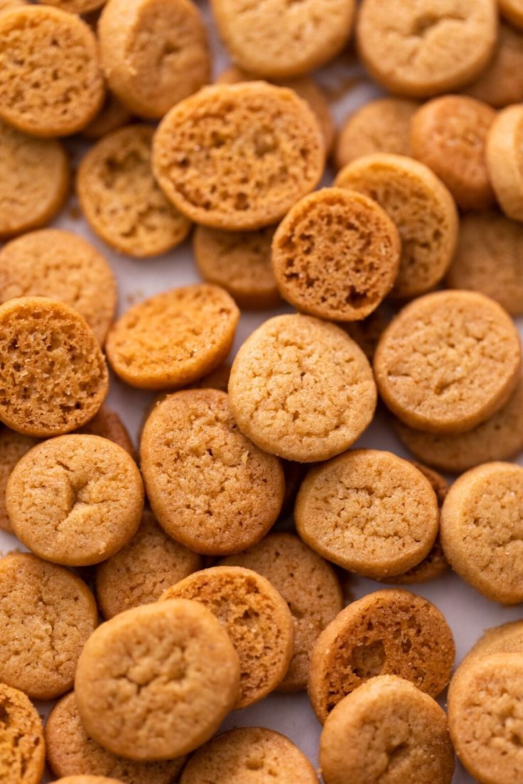 some cookies are sitting on a white surface and there is no image here to provide a caption for