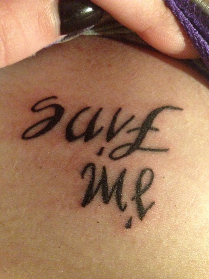 a woman's back tattoo with the words save me written in cursive font