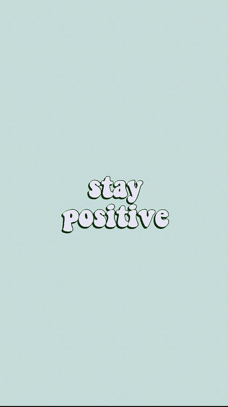 the words stay positive written in green on a blue background