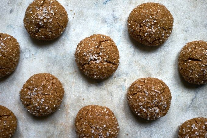 several cookies are lined up on a baking sheet