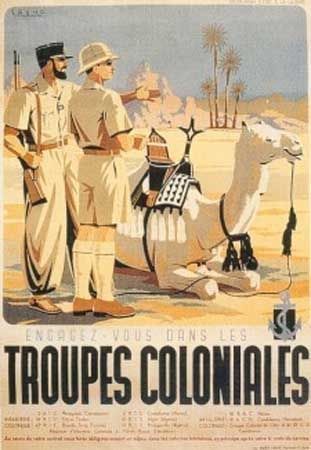 two men standing next to each other in front of an advertisement for tropics coloniales