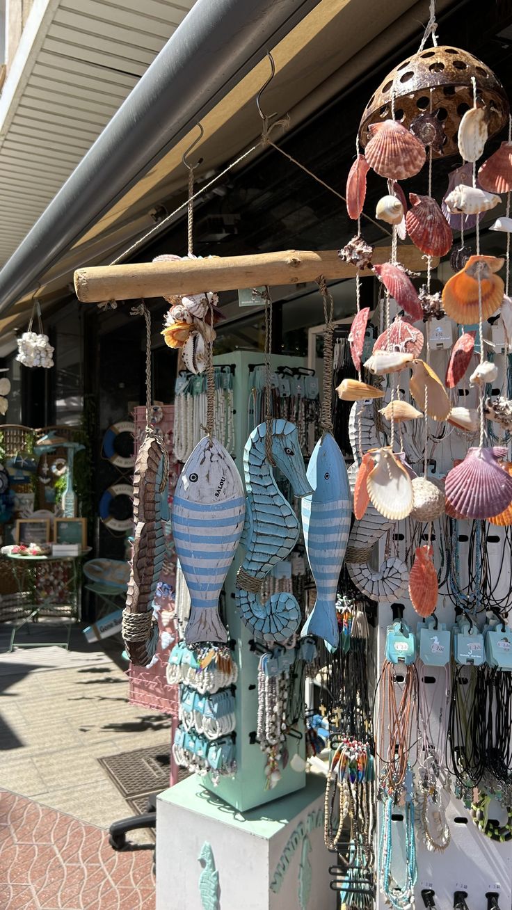 an outdoor market with many different items hanging from it's ceiling and on display