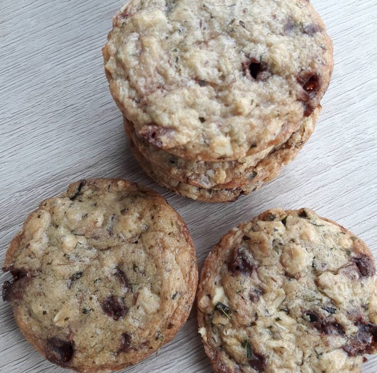 three cookies sitting on top of a white table