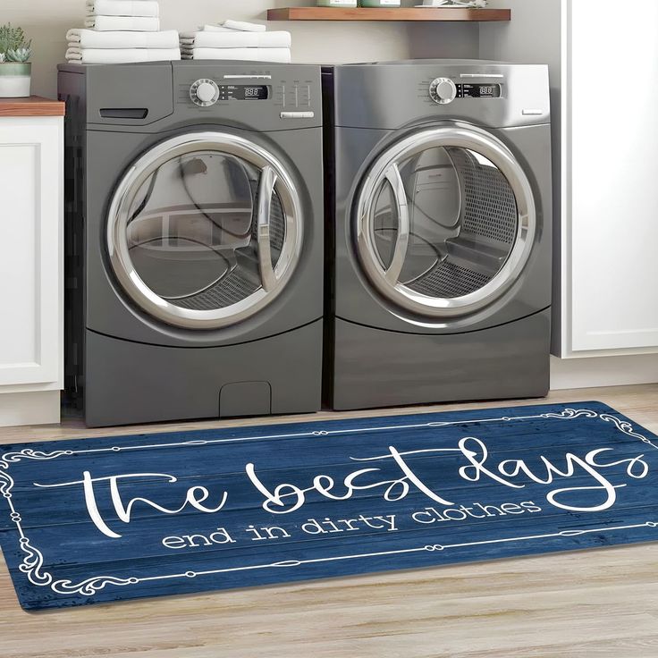 a washer and dryer sitting next to each other in front of a door