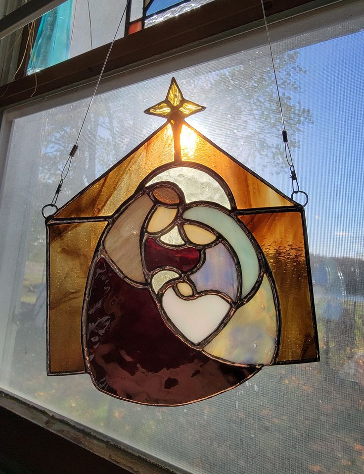 a stained glass window with a nativity scene on it