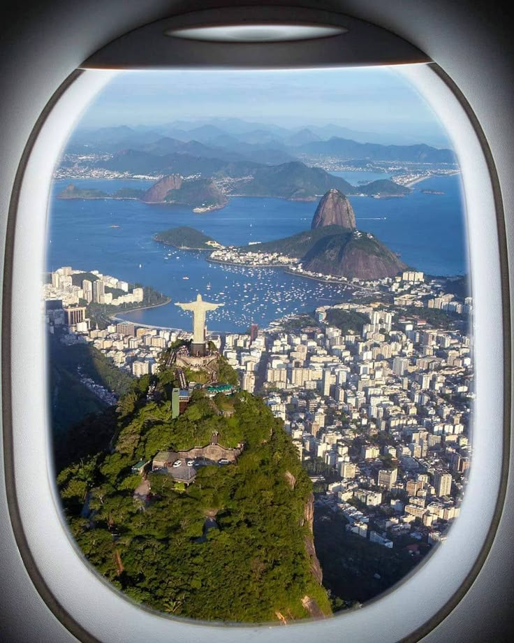 the view from an airplane window looking down on a city