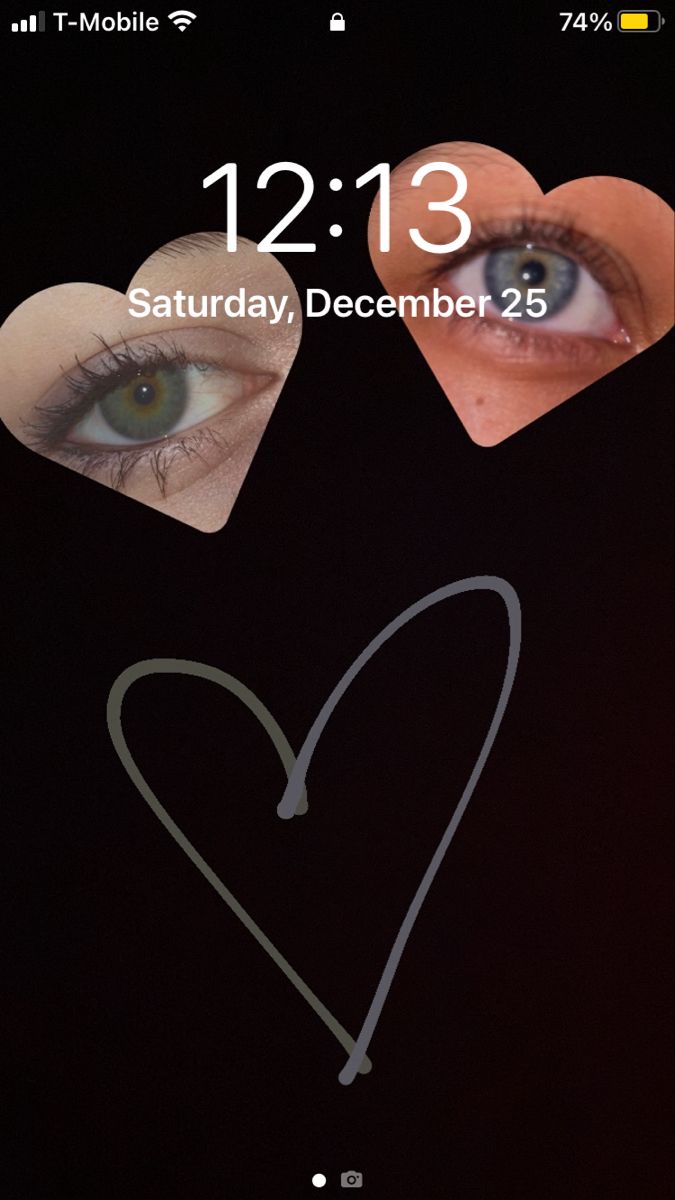 an iphone screen with two hearts and the date 12 13 on it's display