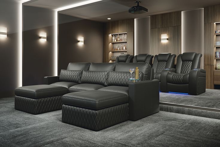 a living room filled with black leather furniture