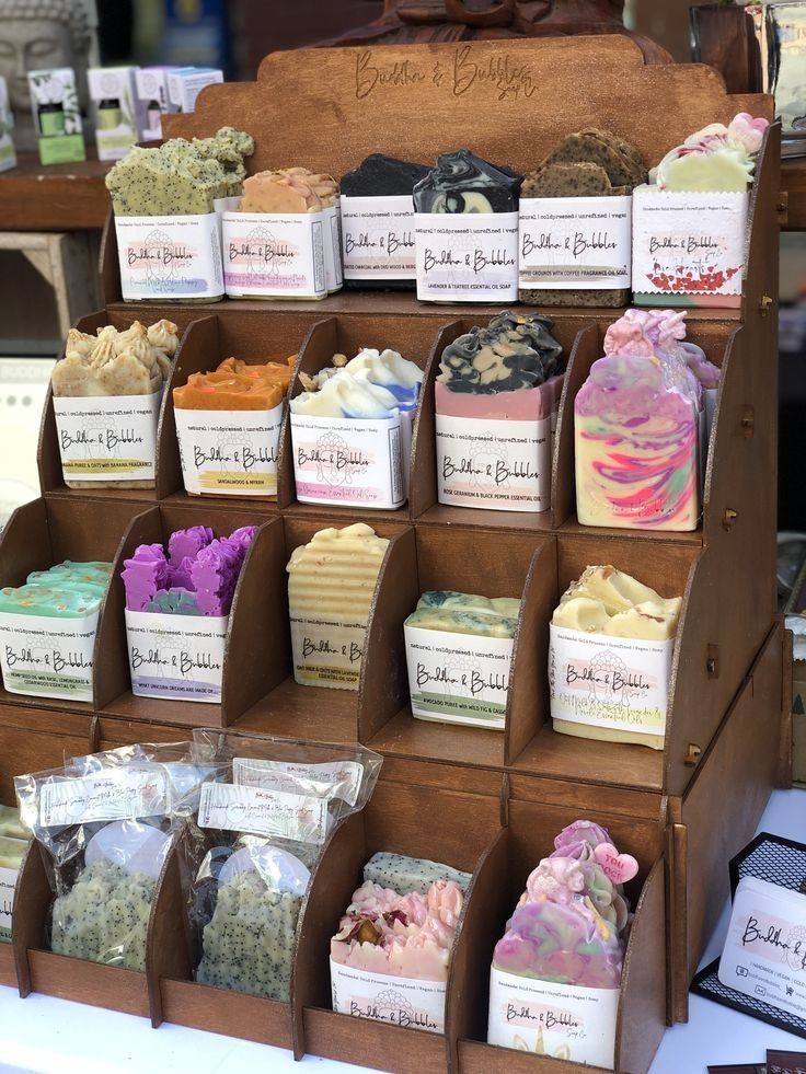 an assortment of soaps on display in a store