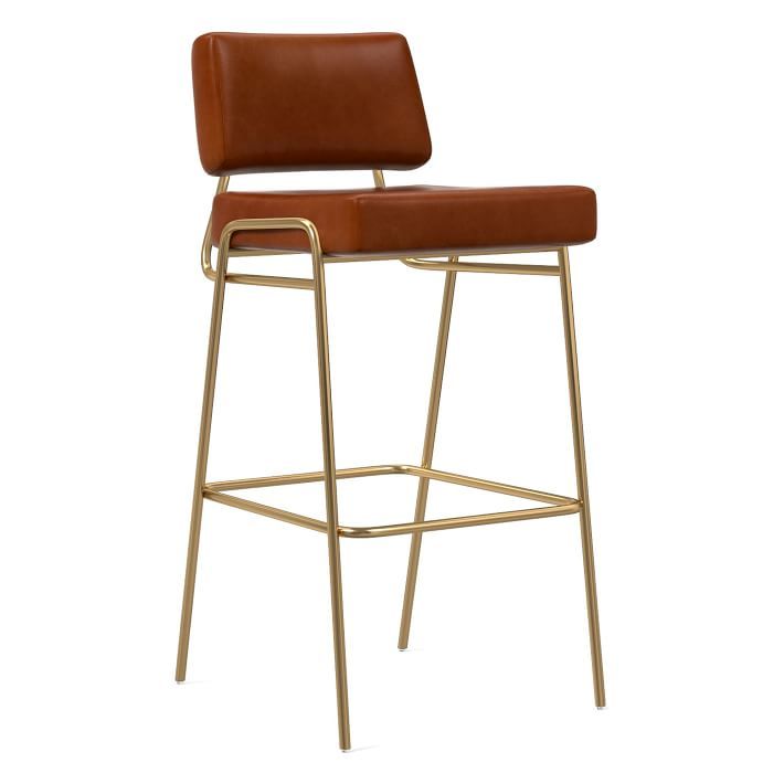 a brown leather bar stool with metal frame and footrests on an isolated white background