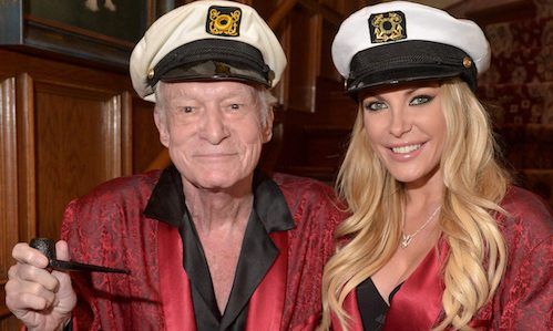 an older man and woman dressed in sailor's hats pose for a photo together